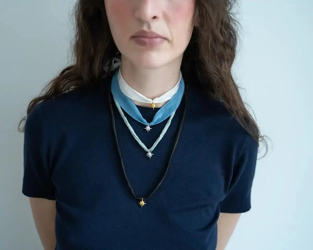 Підвіс DRIMOTA у формі срібної зірки в позолоті з міксом шовкових стрічок