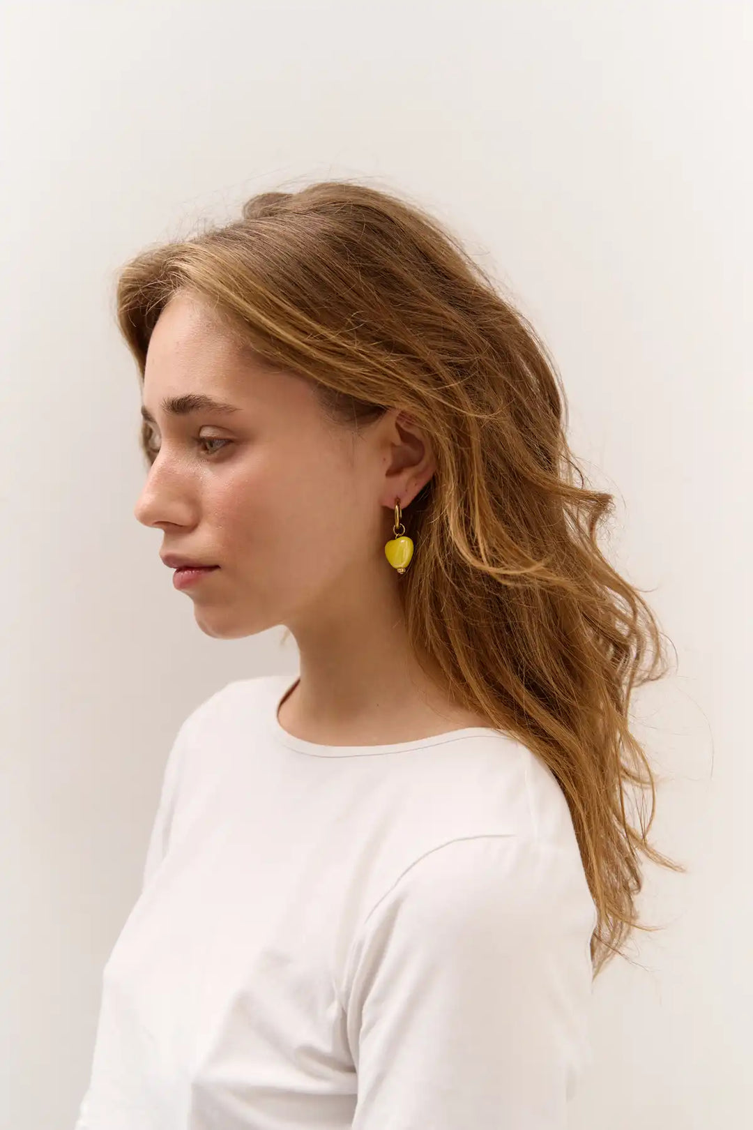 SKARB single earring with a small yellow heart