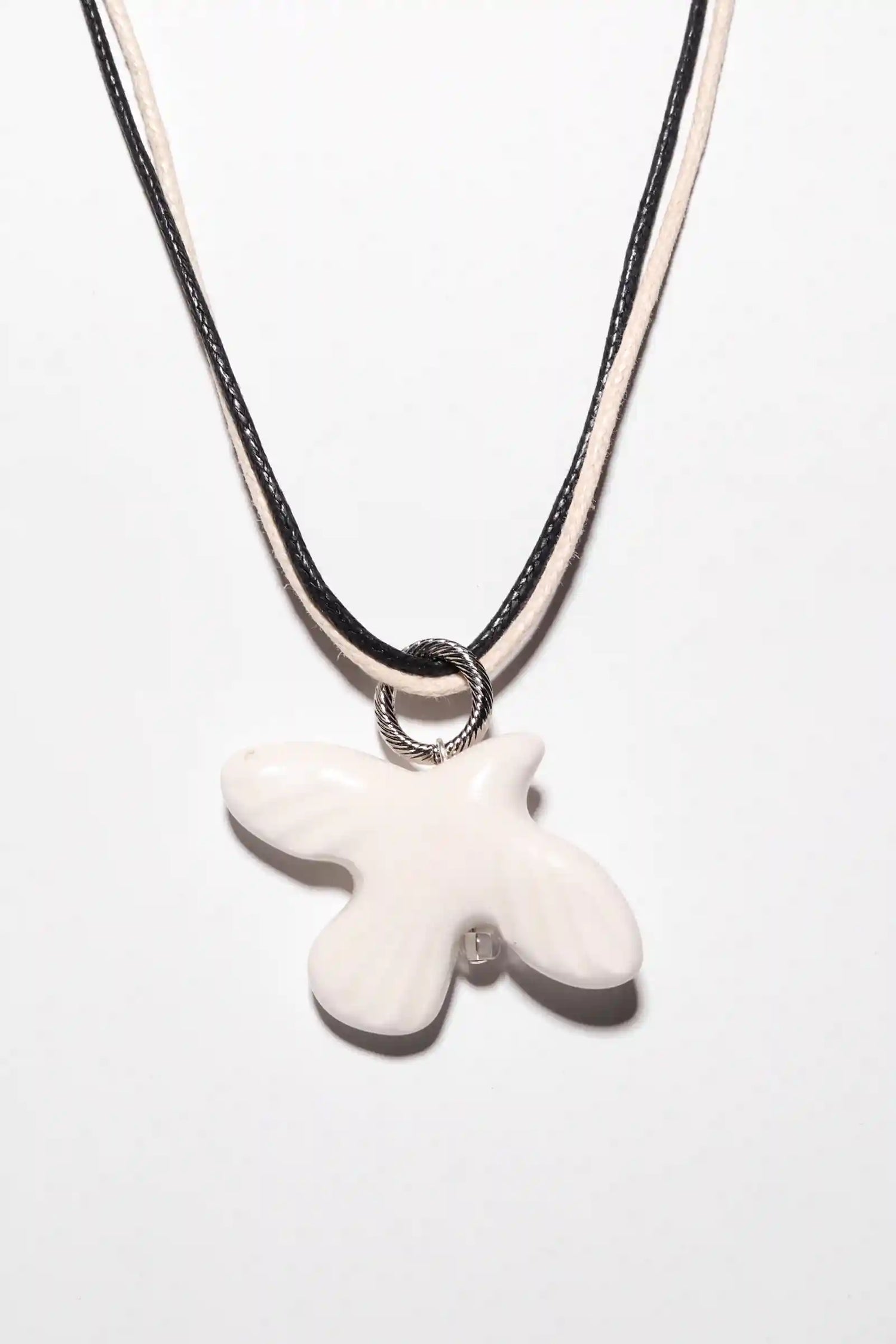 WABI-SABI bird pendant on a cord