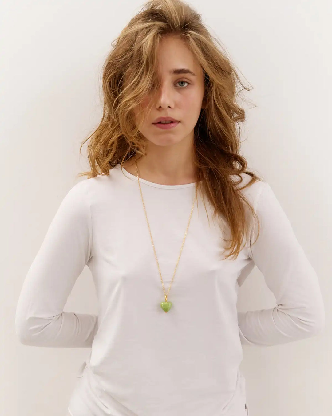 SKARB pendant with a small green heart on a chain