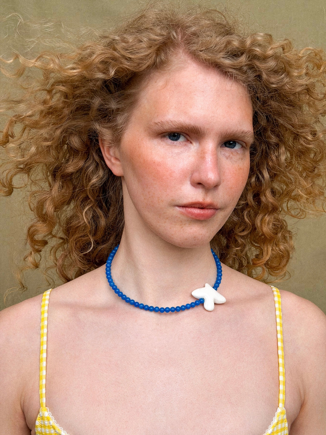 MYRNI necklace with apatite and a bird