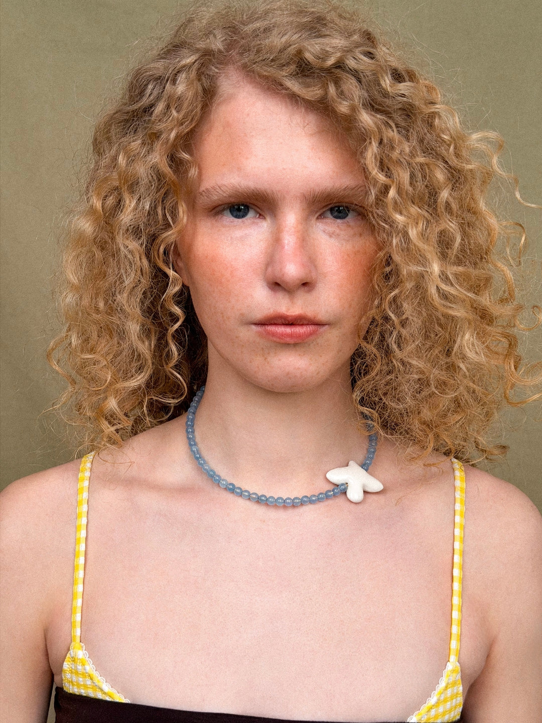 MYRNI necklace with aquamarine and a bird