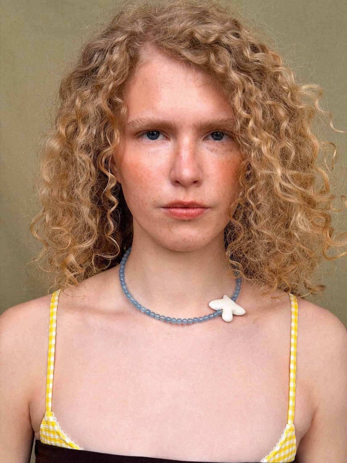 MYRNI necklace with aquamarine and a bird