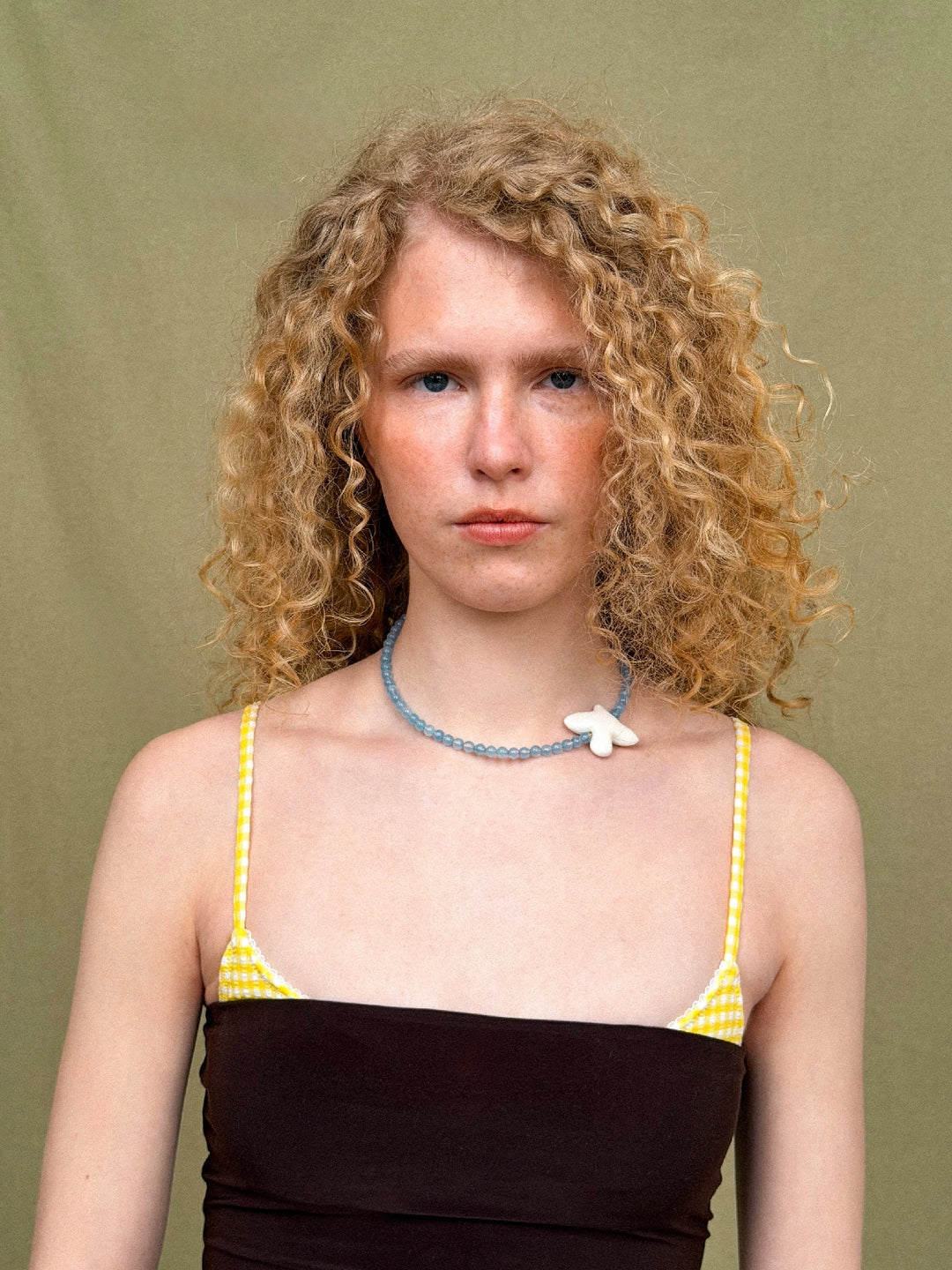 MYRNI necklace with aquamarine and a bird