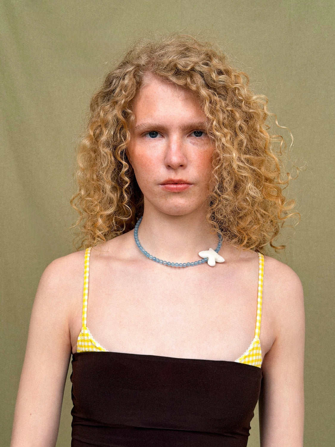 MYRNI necklace with aquamarine and a bird