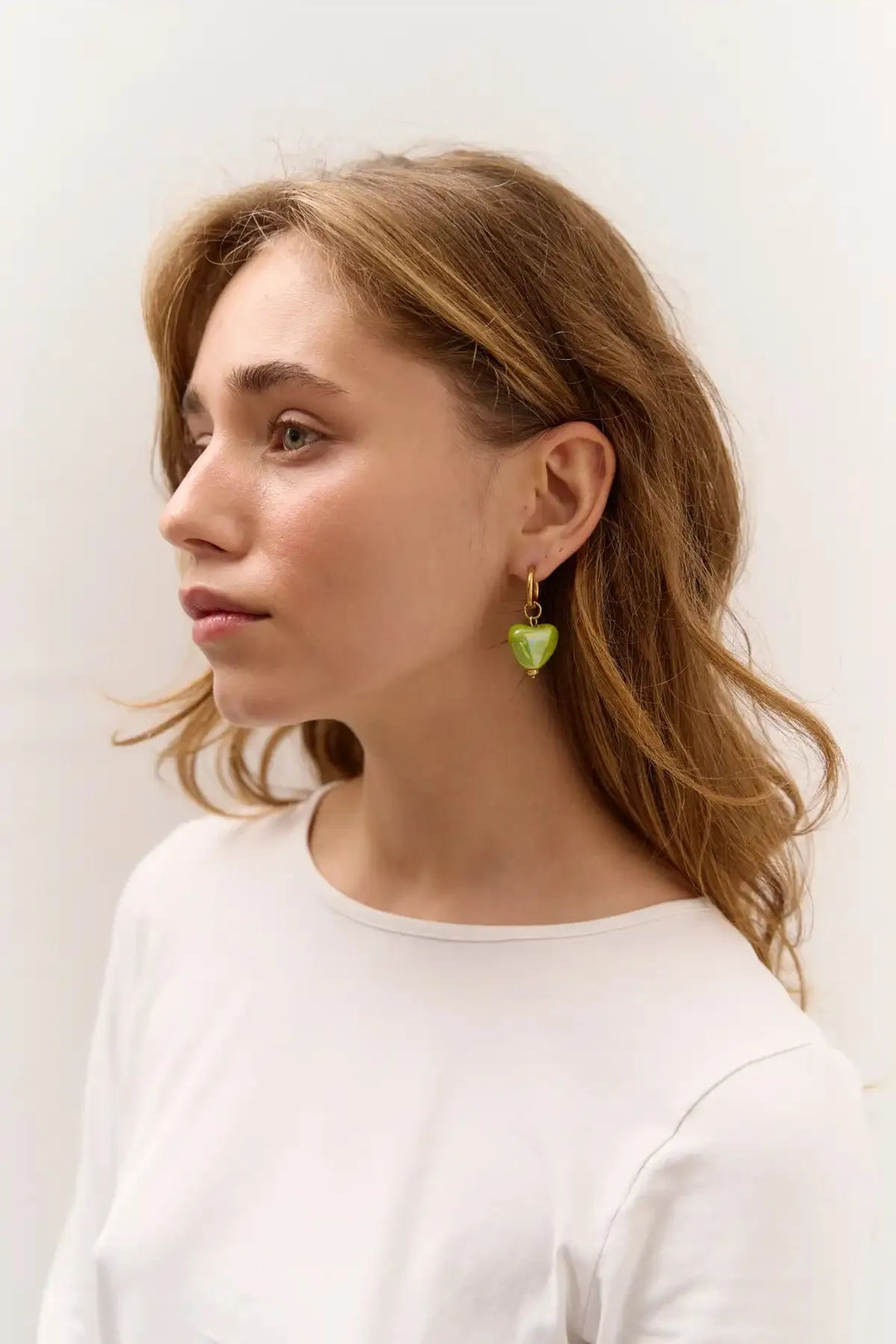 SKARB single earring with a small green heart
