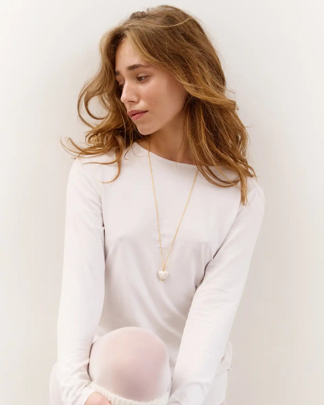 SKARB pendant with a small white heart on a chain