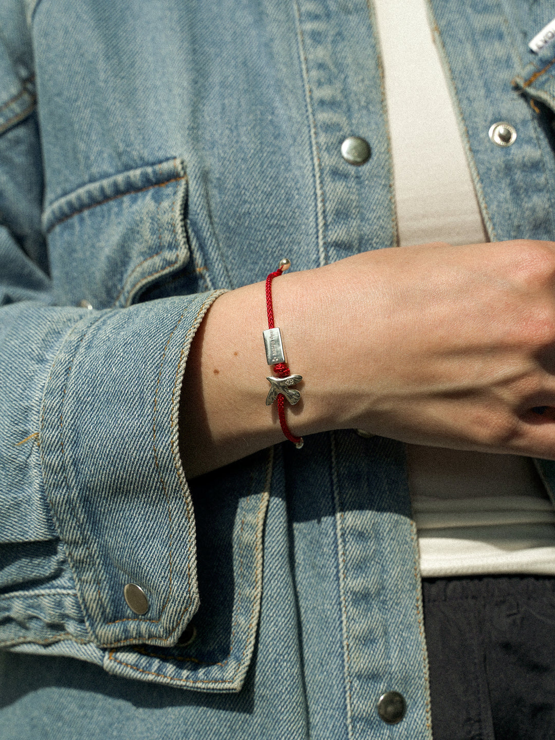 ZAVTRA BUDE bracelet with red cord
