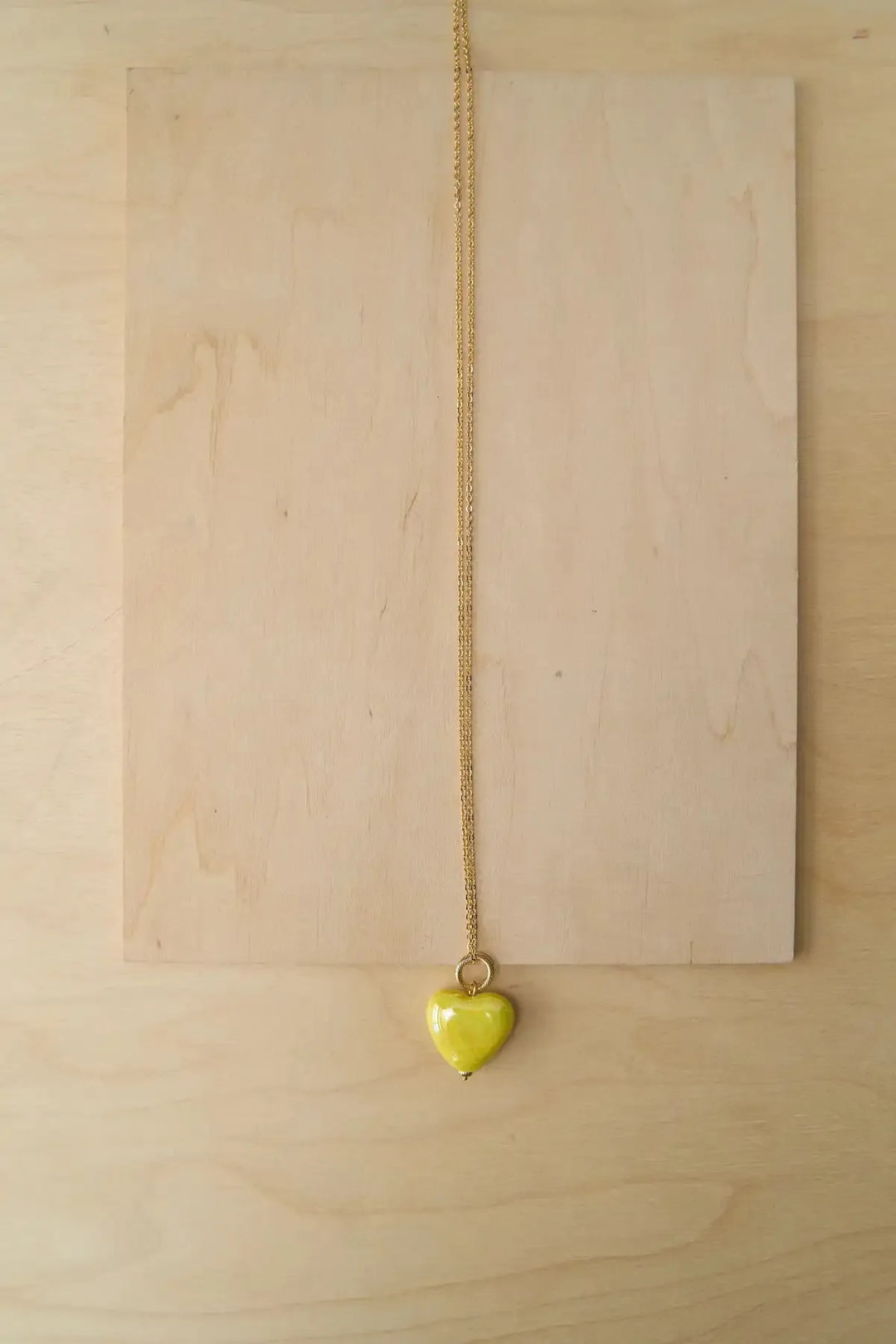 SKARB pendant with a yellow heart on a chain